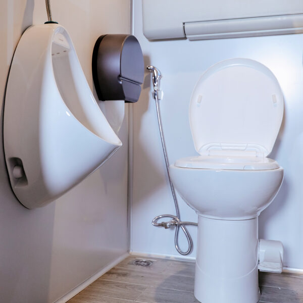 Male urinal setup in Flare portable restroom interior